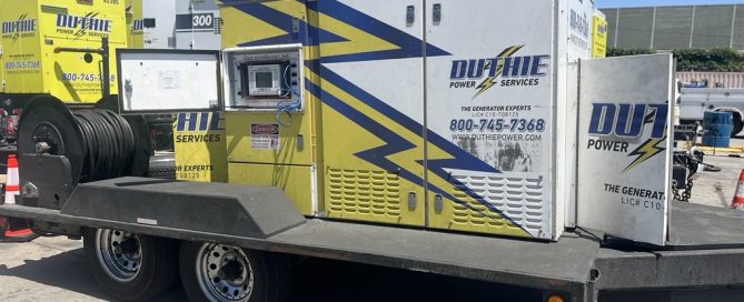 Duthie Power Services Load Bank on a trailer performing a load test on a commercial rental generator unit.