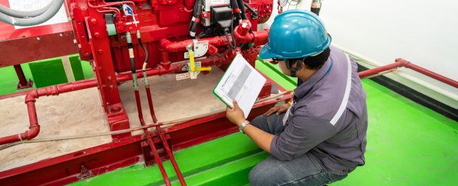 Engineer checking industrial generator fire control system, Diesel engine fire pump controller